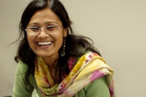 Shakun is a woman of Indian descent with a bright smile.