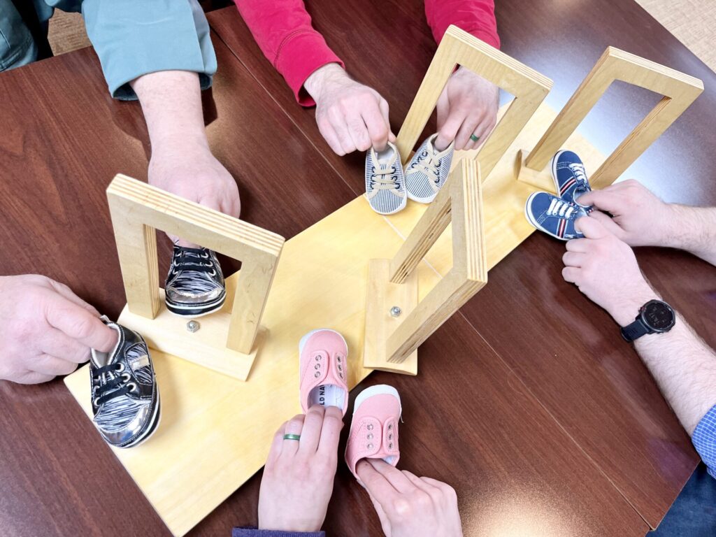 Pictures of shoes going through doors.