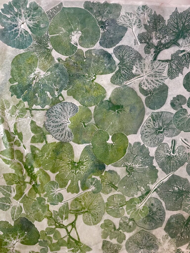 Leaf pattern print in green shades.