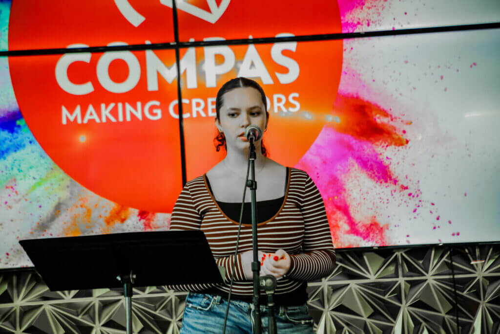 Rhianna performing at the 2026 Youth Spoken Word Showcase.