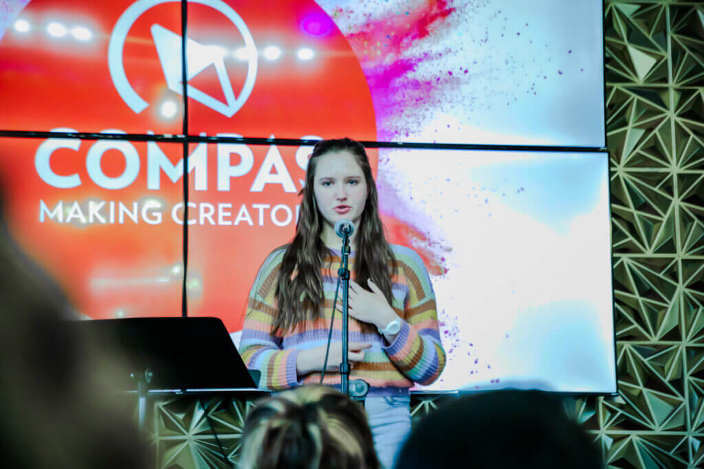 Iris performing at the 2026 Youth Spoken Word Showcase.