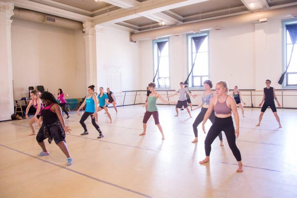 Dancers in a classroom.