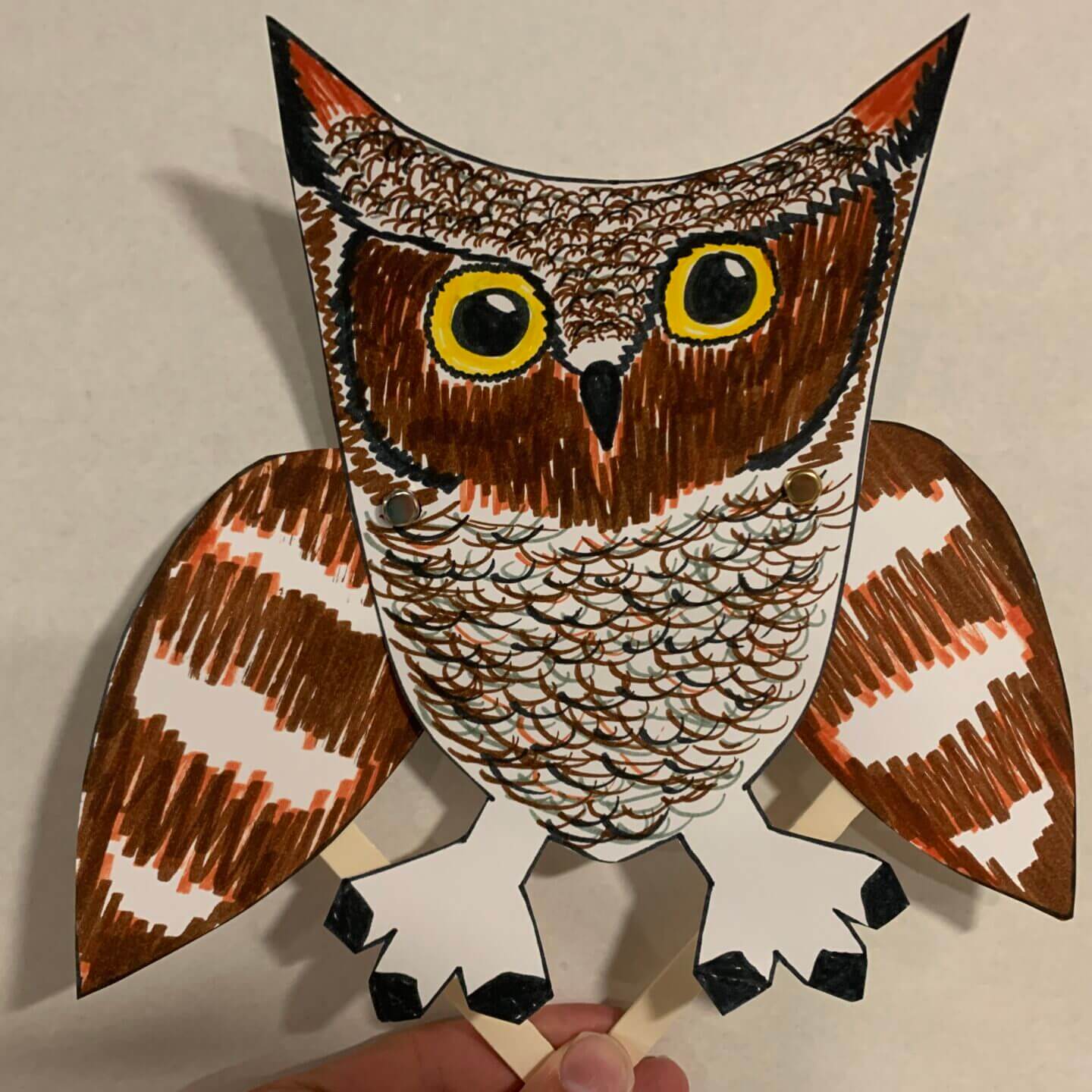 Owl Puppet made with paper and popsicle sticks.